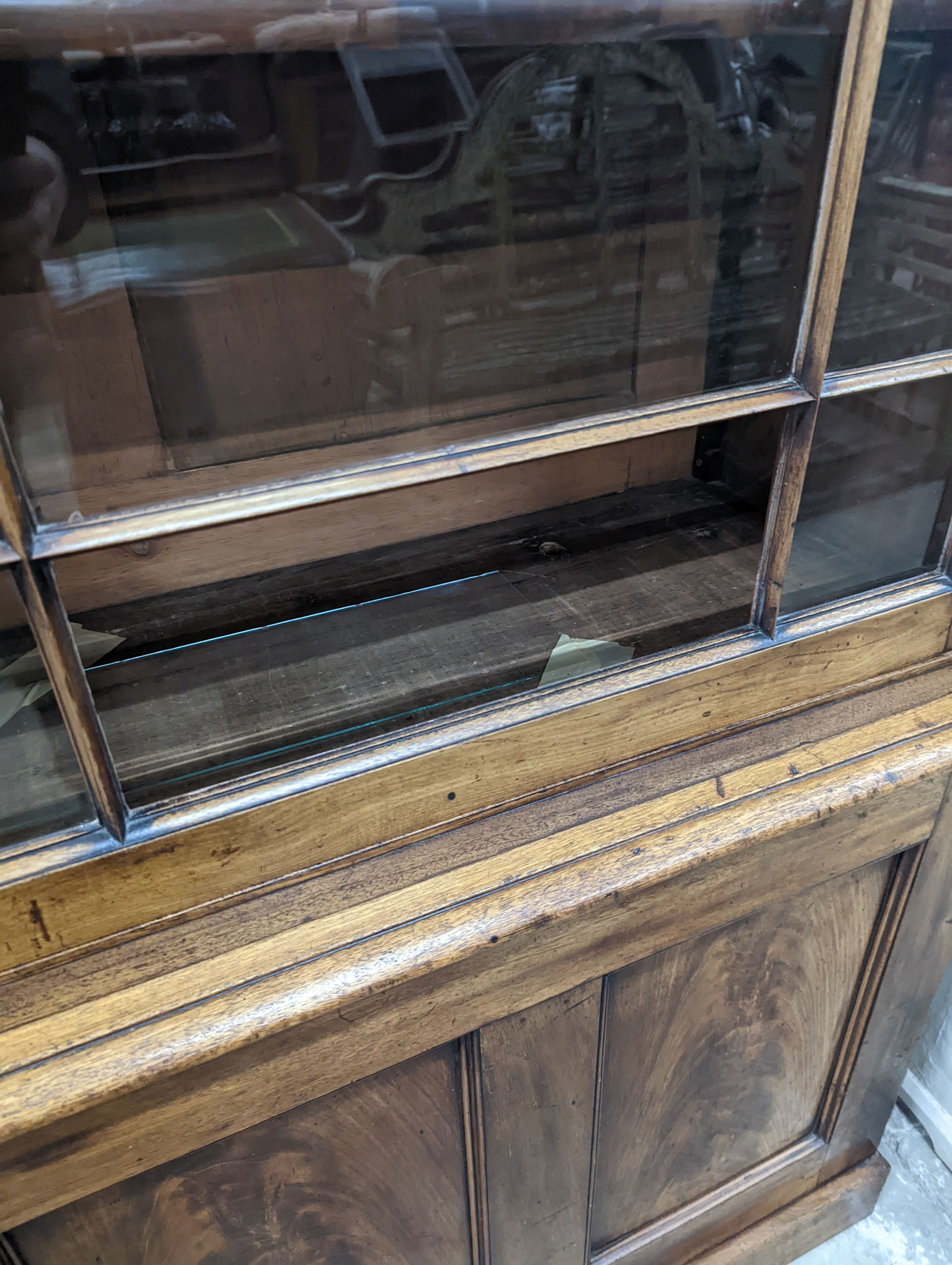 A George III style mahogany library bookcase, width 154cm, depth 38cm, height 217cm